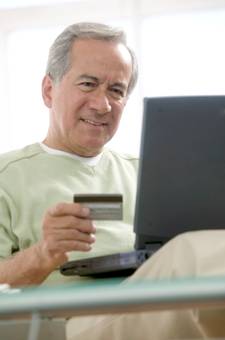 Man paying with credit card on the internet